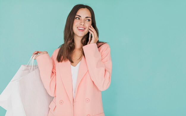 Woman in pink jacket looking to the left