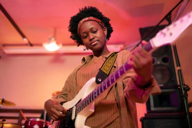 Woman playing the guitar at a local event