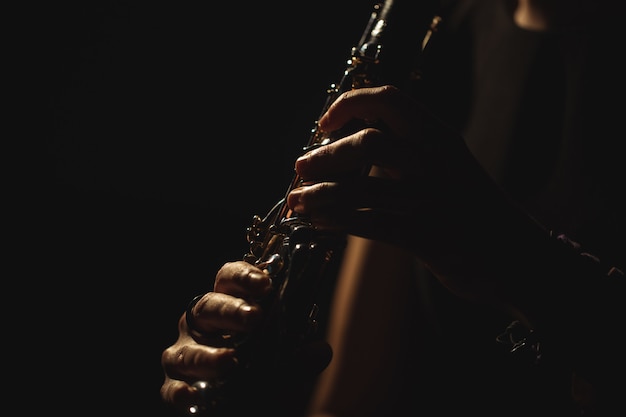 Free photo woman playing a guitar in music school