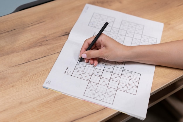 Woman playing a sudoku game