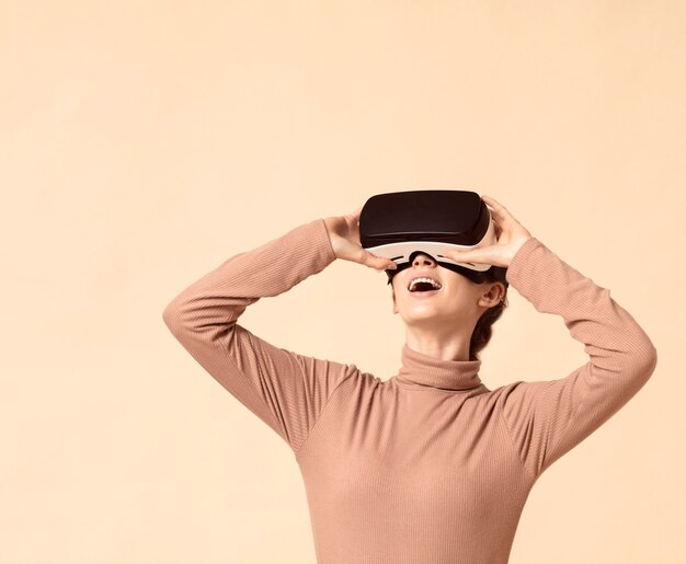 Woman playing on virtual reality headset and looking up