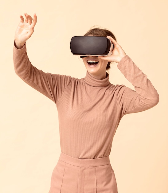 Free Photo woman playing on virtual reality headset