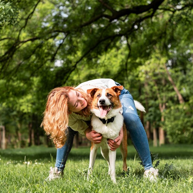 Woman playing with her dog in the park