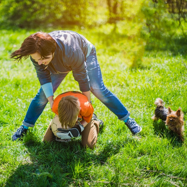 Woman playing with her son in the park