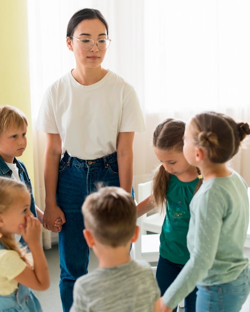 Woman playing with her students