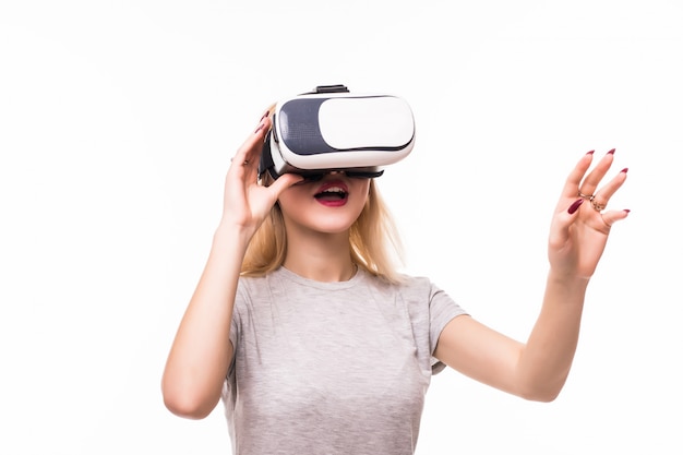 woman plays new games using vr-glasses in room with white walls