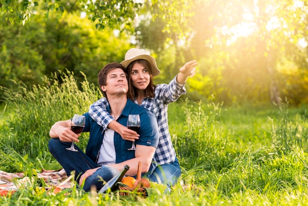 Woman pointing direction with hand for man