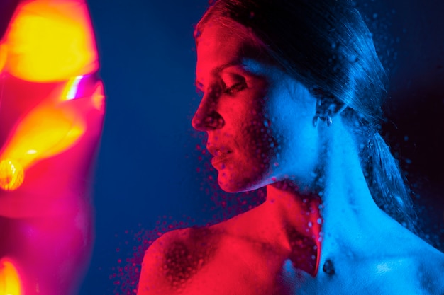 Free photo woman portrait with blue lights visual effects