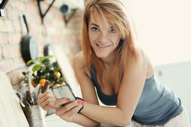 Free Photo woman posing in the kitchen