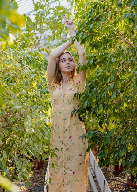 Free Photo woman posing in the middle of foliage