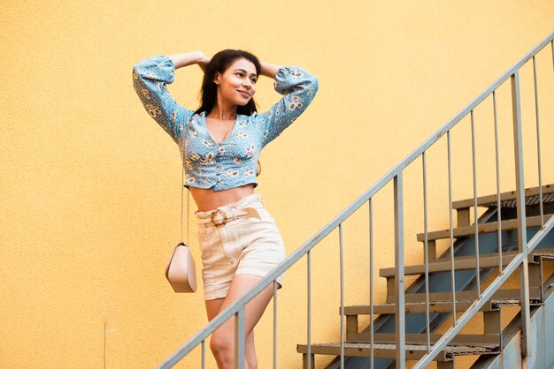 Woman posing on the stairs