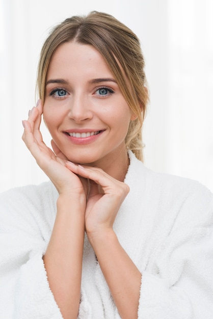 Free photo woman posing with bathrobe in a spa