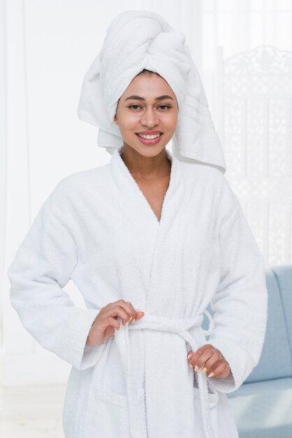 Woman posing with bathrobe in a spa