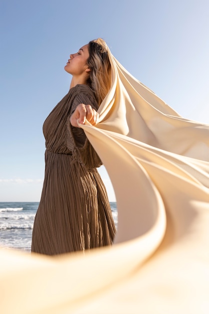 Woman posing with cloth medium shot