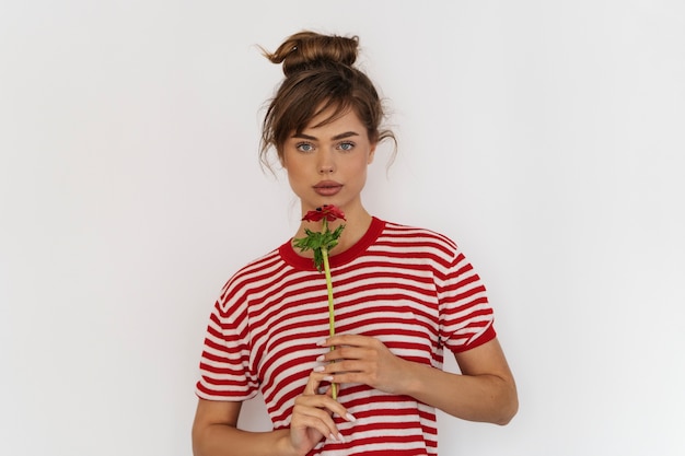 Free photo woman posing with flower front view