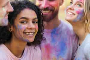 Free photo woman posing with friends at festival