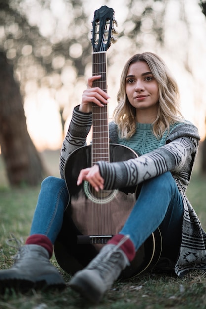 Woman posing with guitar