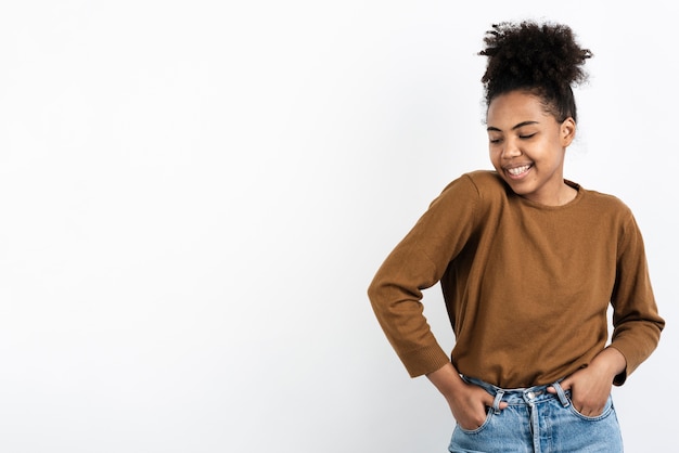 Woman posing with hands in pockets