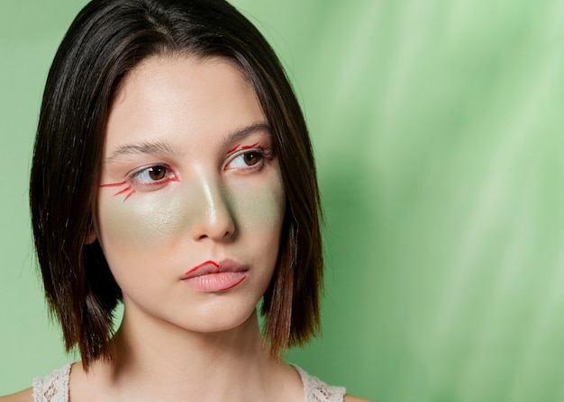 Free photo woman posing with painted face