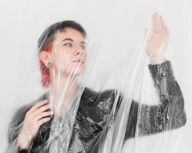 Woman posing with plastic foil