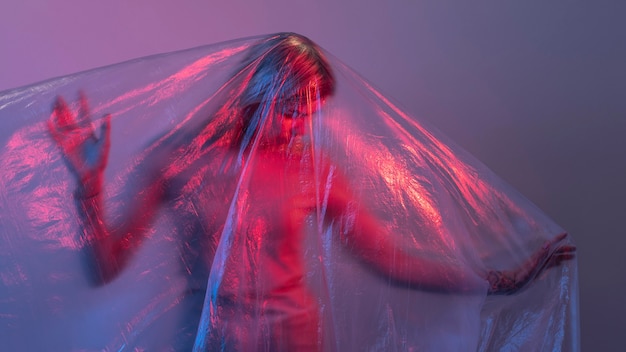 Woman posing with plastic foil