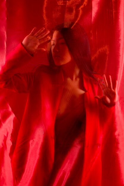 Woman posing with red cloth