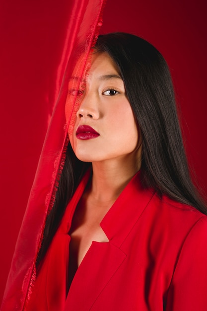 Woman posing with red lipstick and cloth