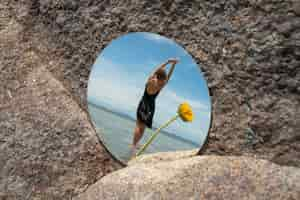 Free photo woman posing with round mirror and flower