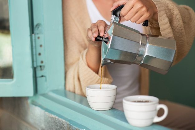 Woman pouring coffee for her and her boyfriend