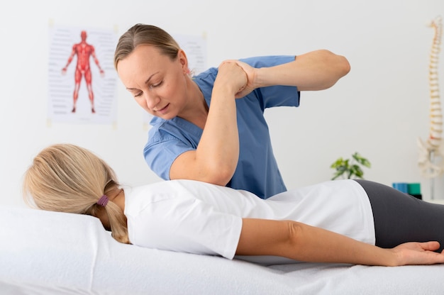 Woman practicing an exercise in a physiotherapy session