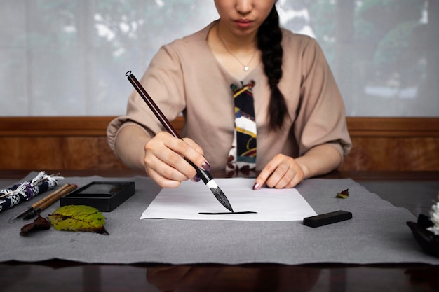 Woman practicing japanese handwriting