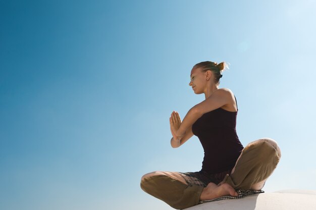 Woman practicing padmasana