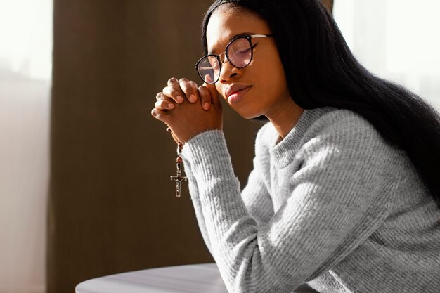 Woman praying for her loved ones