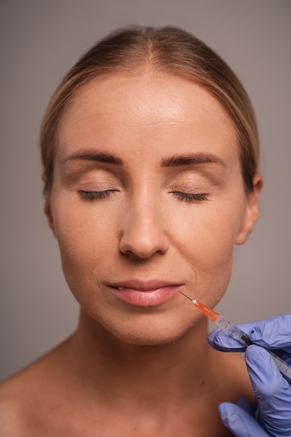 Free photo woman preparing for cosmetic surgery