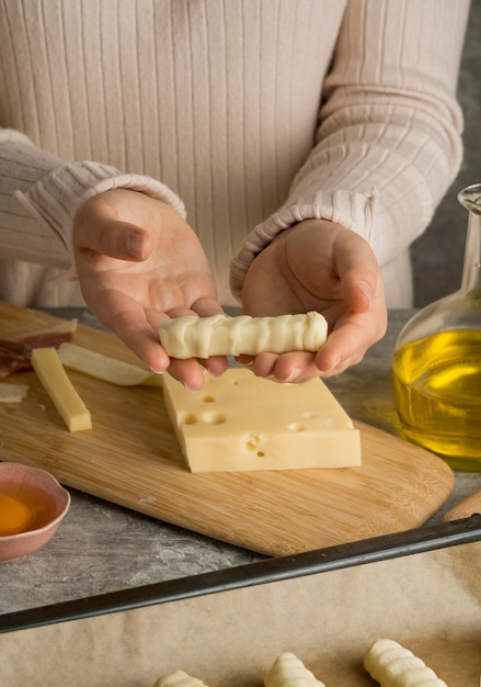 Woman preparing some traditional tequenos