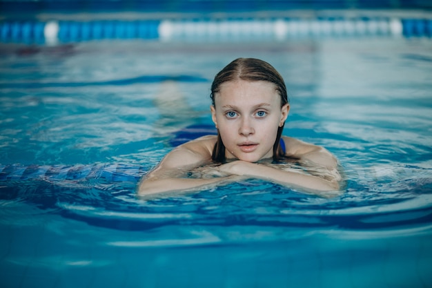 Woman professional swimmer in swimming pool