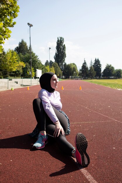 Woman in purple jacket training