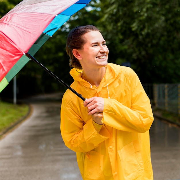 Woman in rain coat smiling