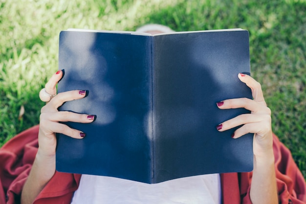 Woman reading book in nature