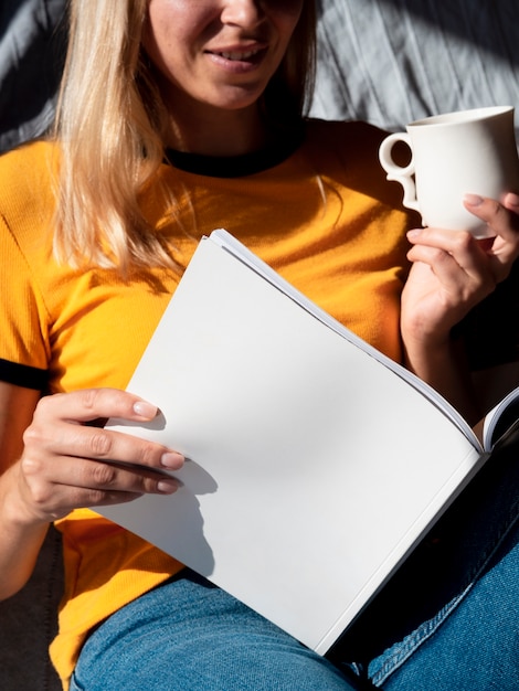 Woman reading a mock-up magazine