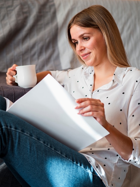 Woman reading a mock-up magazine