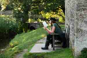 Free photo woman reading while traveling alone