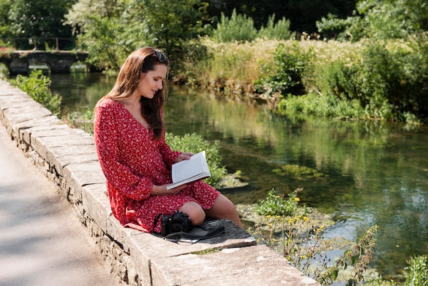 Woman reading while traveling alone