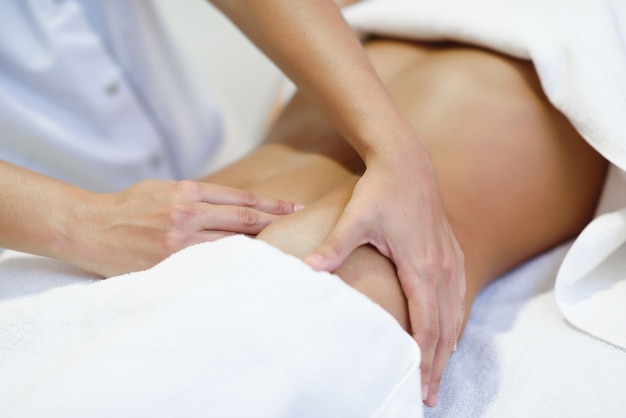 Free photo woman receiving a belly massage at spa salon