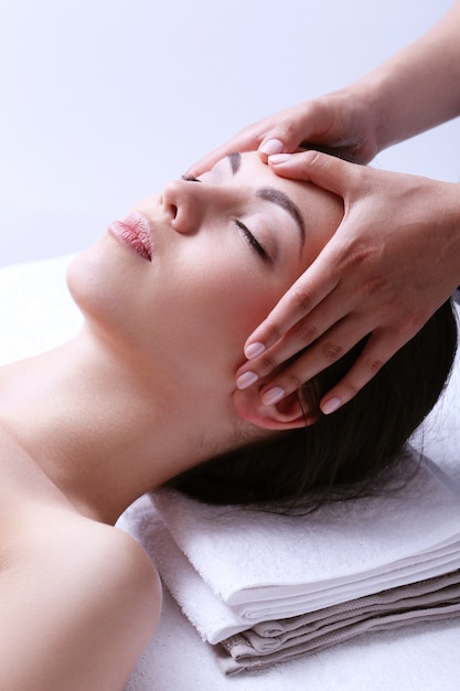 Woman receiving massage on a spa center