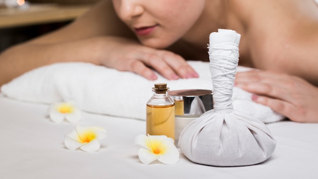 Woman receiving massage in spa center