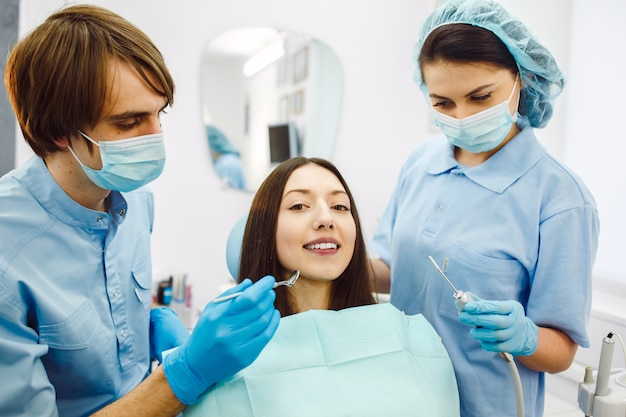 The woman on reception at the dentist with assistant