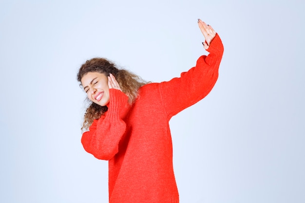 Free Photo woman in a red shirt stopping and preventing something. 