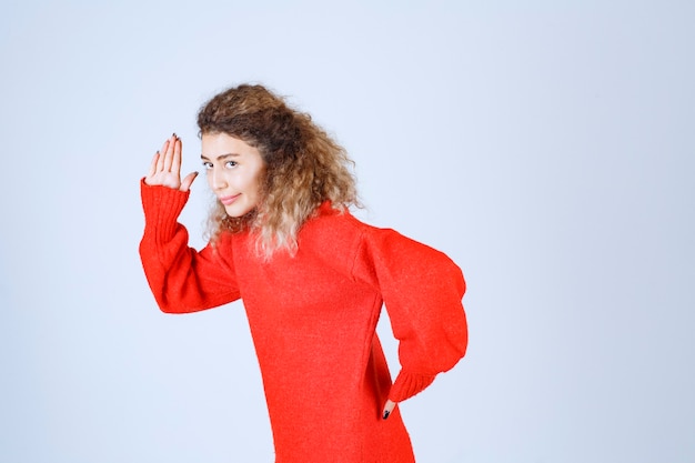 Free Photo woman in red sweatshirt escaping from the place.