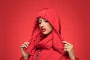 Free photo woman in red winter hooded jacket